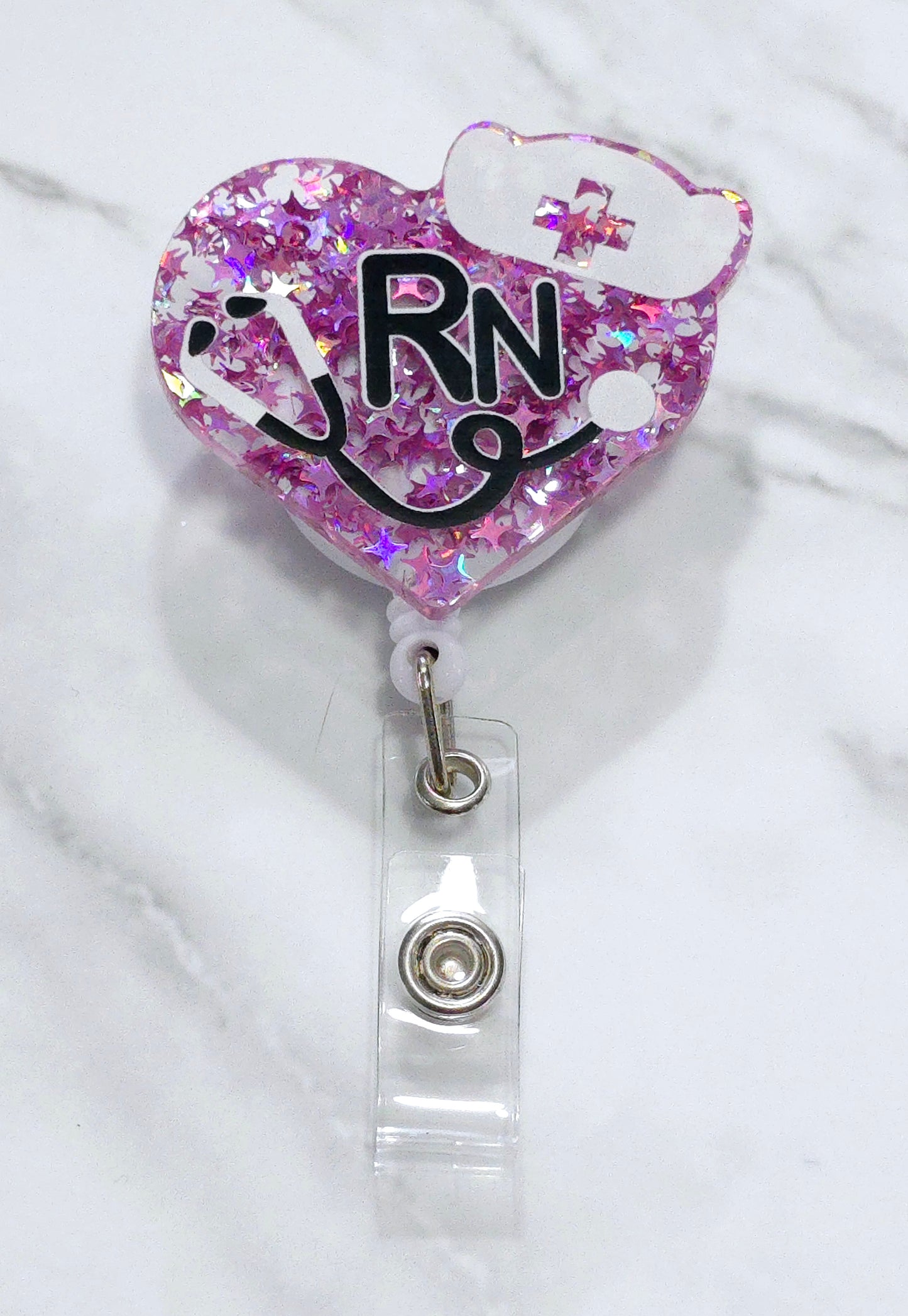 RN with black stethoscope badge reel